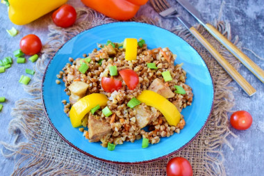 Buckwheat with pork meat in a frying pan