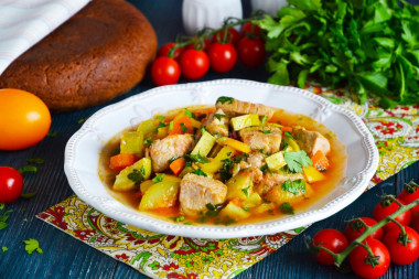 Pork stewed with vegetables in a frying pan