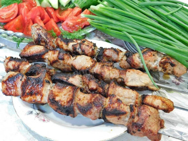 Shish kebab in red wine on the grill