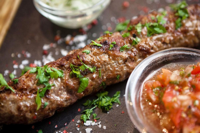 Minced pork and beef kebab on the grill