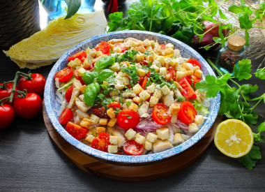 Peking cabbage salad with chicken croutons and tomatoes