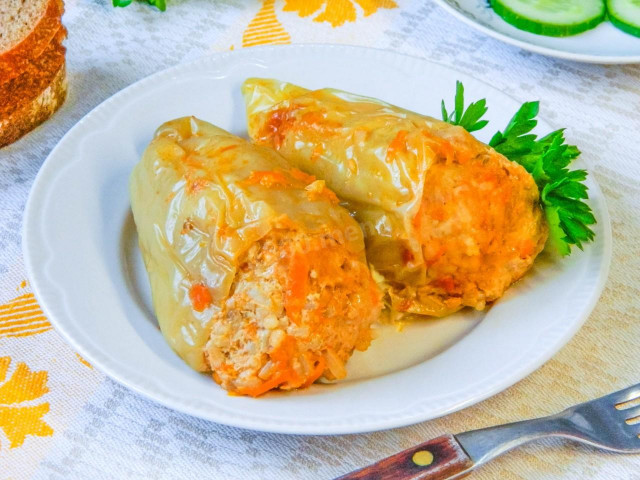 Peppers stuffed with meat and rice in a saucepan