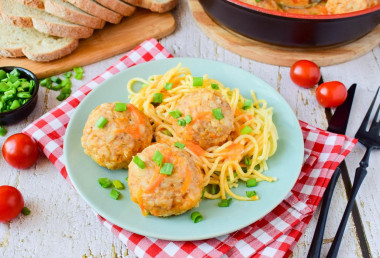 Minced meat meatballs with rice in a frying pan