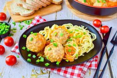 Minced meat meatballs with rice in a frying pan