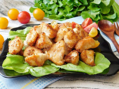 Chicken fillet in pieces in a frying pan