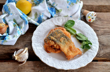 Pink salmon in batter in a frying pan