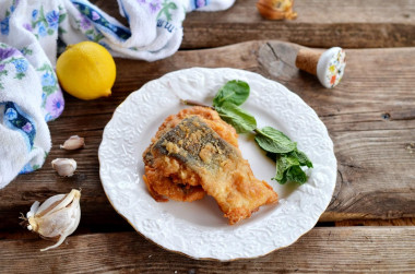 Pink salmon in batter in a frying pan