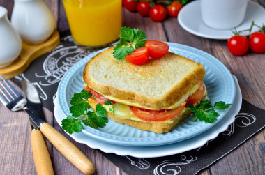 Egg and cheese sandwich in a frying pan