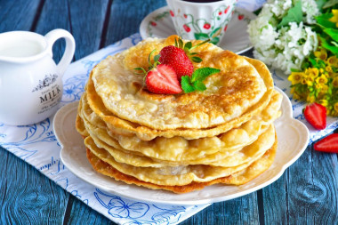 Tortillas on water with an egg in a frying pan