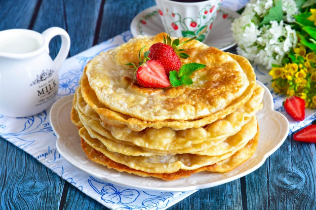 Tortillas on water with an egg in a frying pan