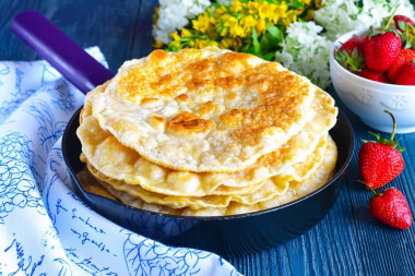 Tortillas on water with an egg in a frying pan