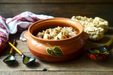 Buckwheat with meat in pots in the oven