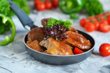 Turkey thigh fillet on frying pan