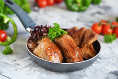 Turkey thigh fillet on frying pan