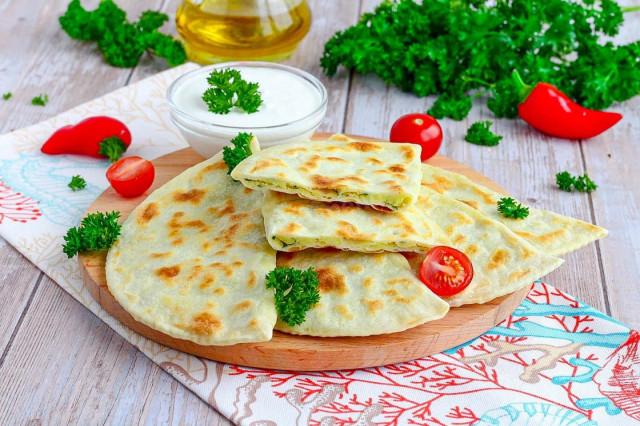 Thin tortillas in a frying pan made of dough with filling