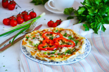 Fried eggs in pita bread in a frying pan with cheese