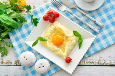 Breakfast of eggs and cheese in a frying pan