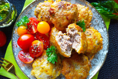 Minced meat in batter in a frying pan