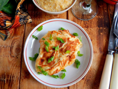 Pork chops in batter in a frying pan