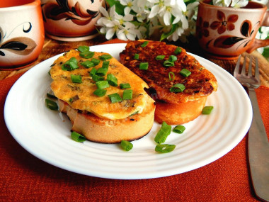 Sandwiches with egg and cheese in a frying pan