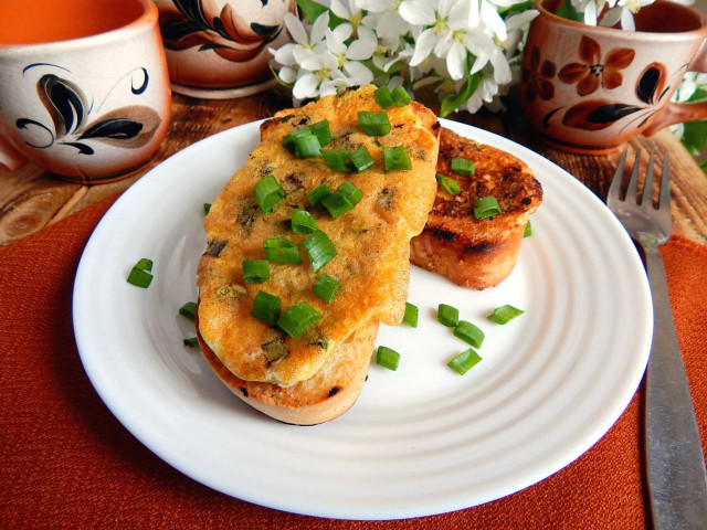 Sandwiches with egg and cheese in a frying pan