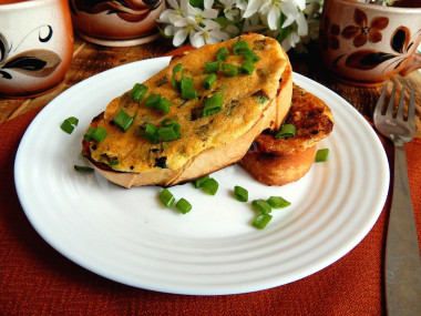 Sandwiches with egg and cheese in a frying pan