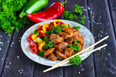 Pork in teriyaki sauce on frying pan