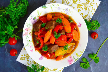 Beef with vegetables in a cauldron