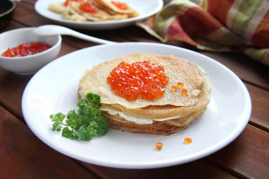 Pancakes with red caviar