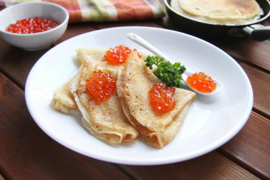 Pancakes with red caviar