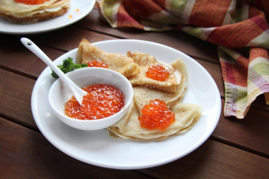 Pancakes with red caviar