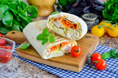 Homemade shawarma with cheese in pita bread in a frying pan