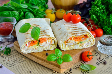 Homemade shawarma with cheese in pita bread in a frying pan