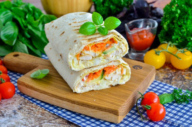 Homemade shawarma with cheese in pita bread in a frying pan