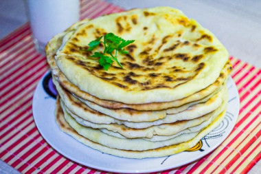 Khachapuri without yeast with cheese in a frying pan