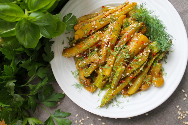 Zucchini with soy sauce and garlic in a frying pan