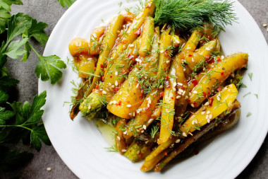 Zucchini with soy sauce and garlic in a frying pan