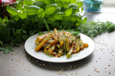 Zucchini with soy sauce and garlic in a frying pan