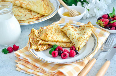 Custard pancakes with milk with holes