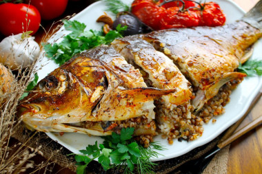 Whole stuffed carp baked in the oven