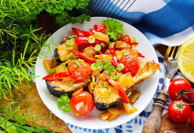 Fish with vegetables in a frying pan