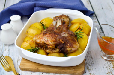 Pork knuckle baked with potatoes in the oven