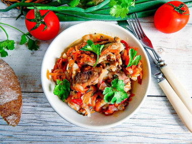 Chicken fillet with vegetables in a frying pan