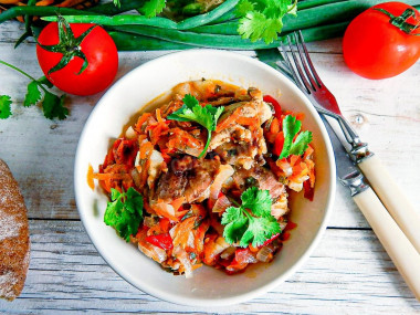 Chicken fillet with vegetables in a frying pan