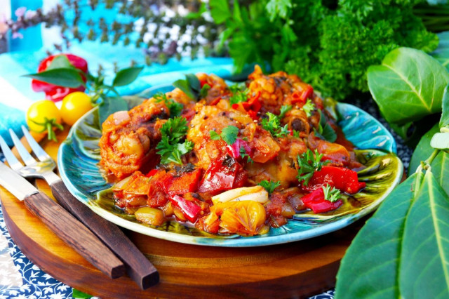 Georgian Chakhokhbili chicken in a cauldron over a campfire