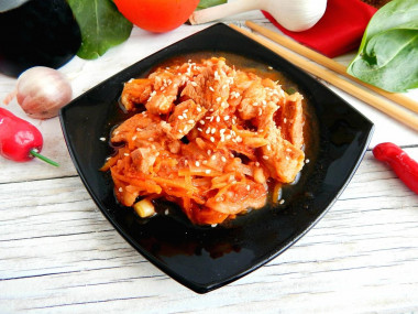 Meat in Chinese sweet sauce in a frying pan