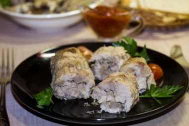 Pork sausage with chicken fillet in foil in the oven