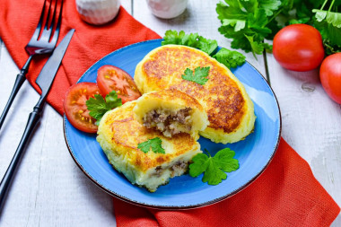 Pies from mashed potatoes in a frying pan