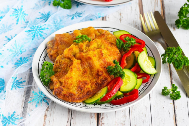 Beef schnitzel in a frying pan