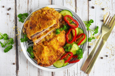 Beef schnitzel in a frying pan